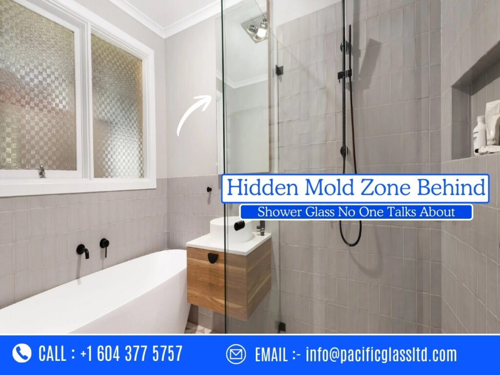 Hidden mold forming behind shower glass enclosure in a Burnaby home bathroom