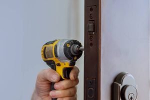 locksmith-hand-holds-the-screwdriver-in-installing-2023-11-27-05-05-24-utc-1.jpg
